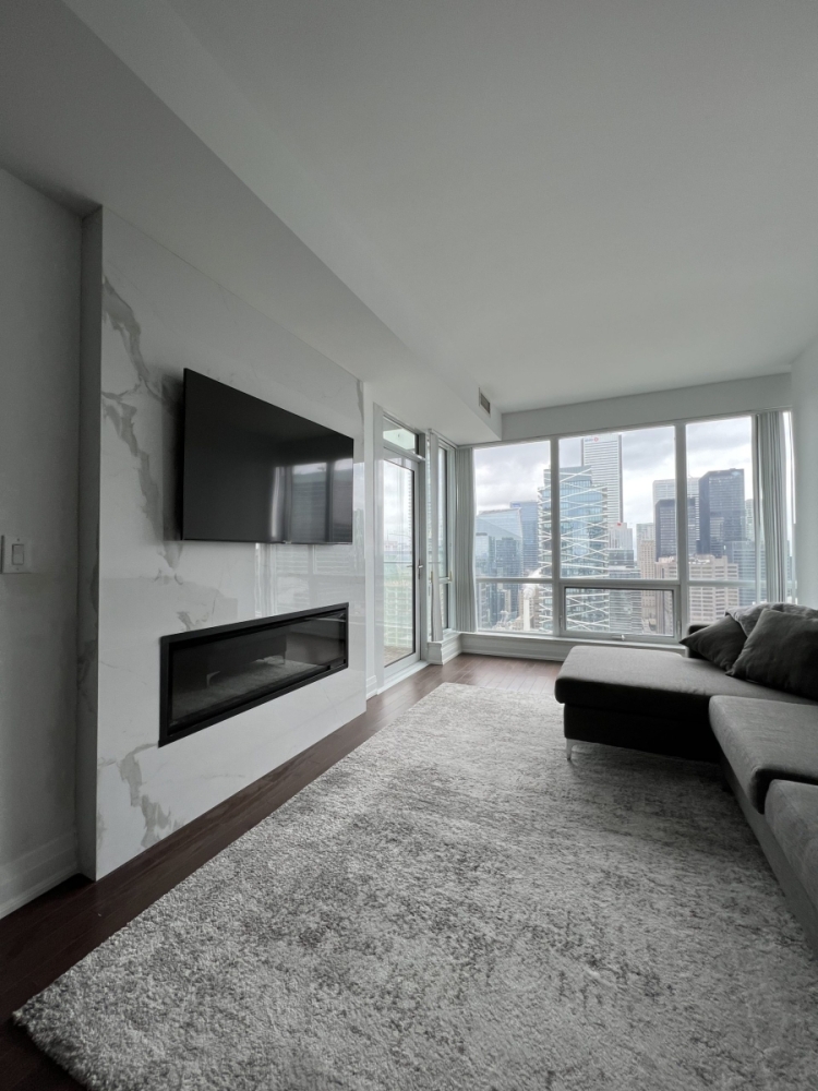 condo with an eletric fireplace